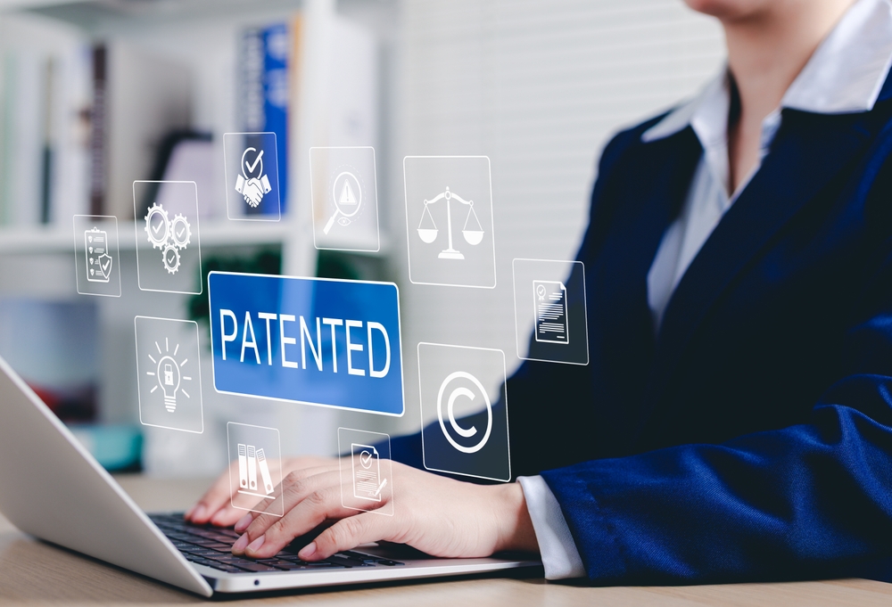 patent,protection,and,intellectual,property,rights,concept.,businesswoman,using,laptop