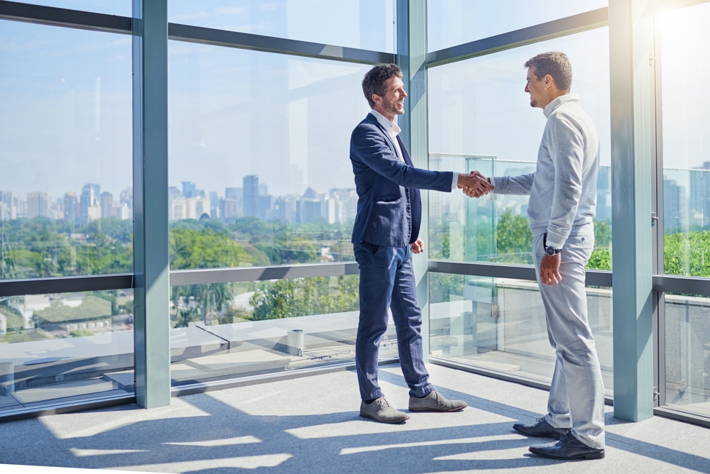 handshake,,meeting,and,business,men,in,office,with,welcome,for